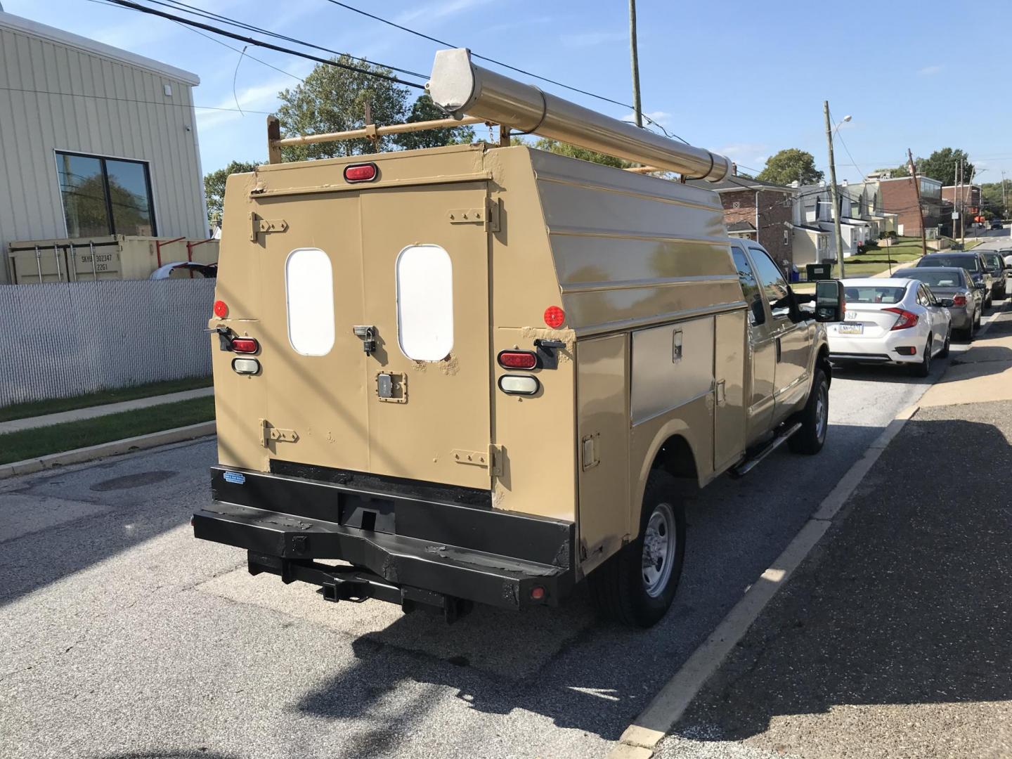 2011 Tan /Gray Ford F-250 SD SuperCab 4WD (1FT7X2B66BE) with an 6.2L V8 OHV 16V engine, 6-Speed Automatic transmission, located at 577 Chester Pike, Prospect Park, PA, 19076, (610) 237-1015, 39.886154, -75.302338 - Photo#2