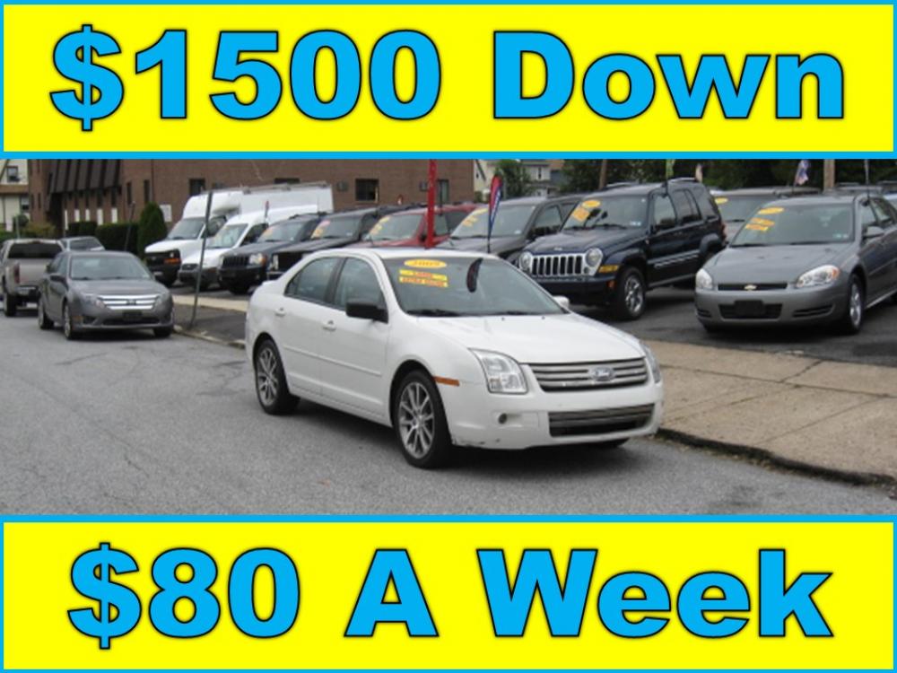 2009 White /Black Ford Fusion V6 SE (3FAHP07149R) with an 3.0L V6 DOHC 24V engine, Automatic transmission, located at 577 Chester Pike, Prospect Park, PA, 19076, (610) 237-1015, 39.886154, -75.302338 - Photo #0