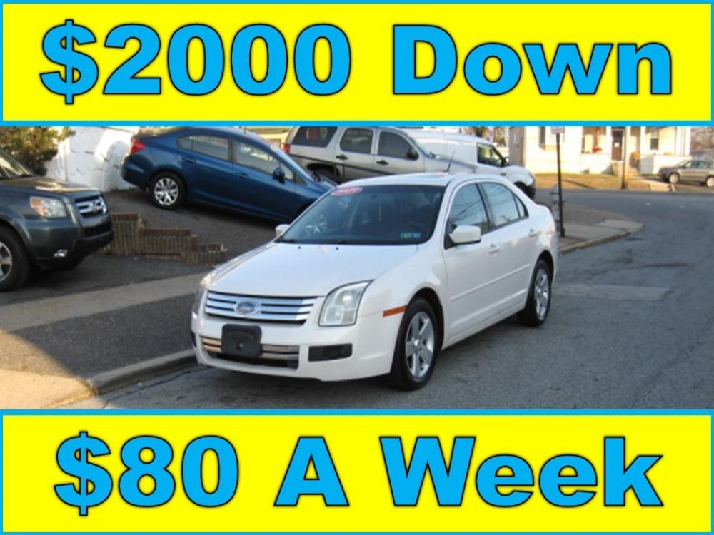 2009 White /Gray Ford Fusion I4 SE (3FAHP07Z49R) with an 2.3L L4 DOHC 16V engine, Automatic transmission, located at 577 Chester Pike, Prospect Park, PA, 19076, (610) 237-1015, 39.886154, -75.302338 - Photo #0