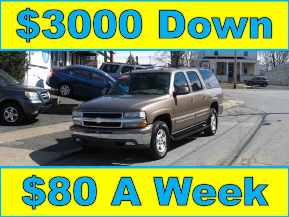 2004 Brown /Tan Chevrolet Suburban 1500 4WD (1GNFK16Z24J) with an 5.3L V8 OHV 16V FFV engine, 4-Speed Automatic Overdrive transmission, located at 577 Chester Pike, Prospect Park, PA, 19076, (610) 237-1015, 39.886154, -75.302338 - Photo #0