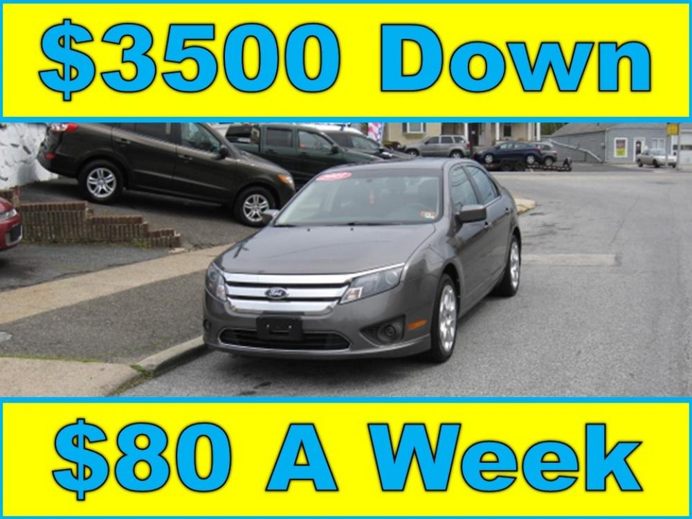 2011 Gray /Gray Ford Fusion I4 SE (3FAHP0HA1BR) with an 2.5L L4 DOHC 16V engine, Automatic transmission, located at 577 Chester Pike, Prospect Park, PA, 19076, (610) 237-1015, 39.886154, -75.302338 - Photo #0