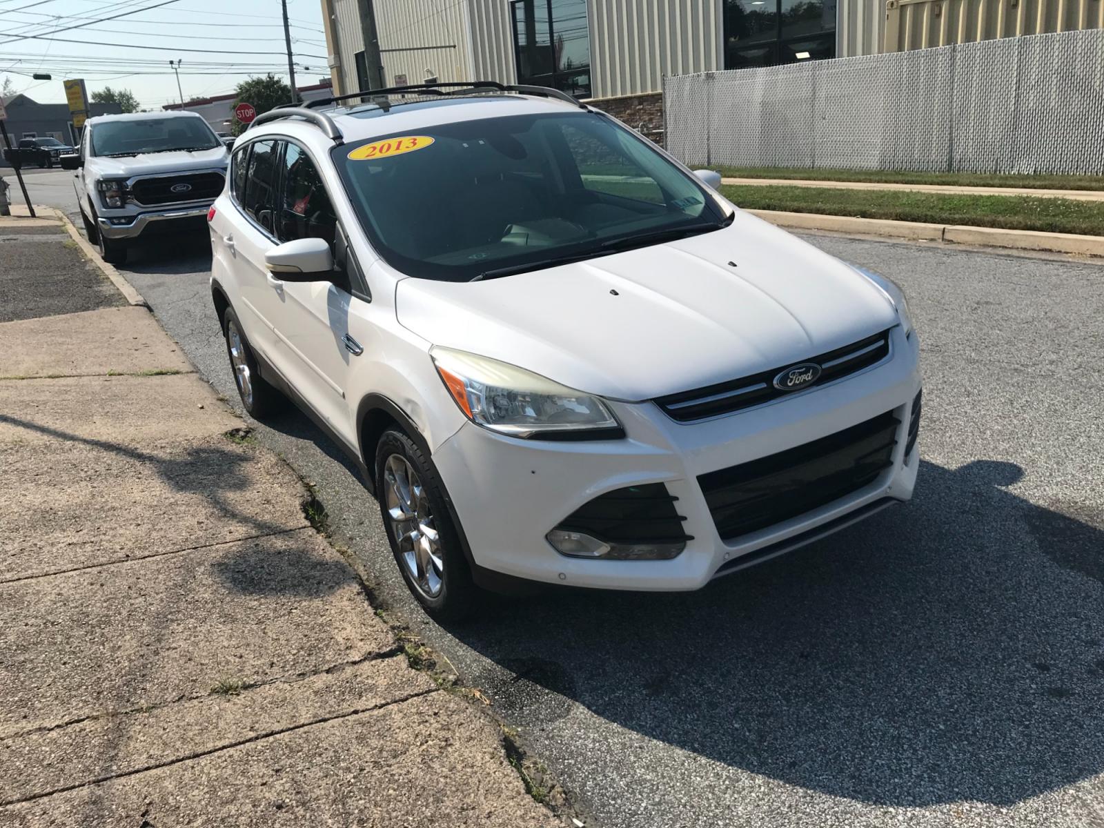 2013 White /Tan Ford Escape SEL 4WD (1FMCU9H92DU) with an 2.0L L4 DOHC 16V engine, 6-Speed Automatic transmission, located at 577 Chester Pike, Prospect Park, PA, 19076, (610) 237-1015, 39.886154, -75.302338 - 13 Ford Escape SEL: 4x4, sunroof, nice radio w/ bluetooth, dual exhaust, trailer hitch, looks and runs LIKE NEW! This vehicle comes inspected and has been given a bumper to bumper safety check. It is very clean, reliable, and well maintained. We offer a unique pay plan that is known for being the - Photo #3