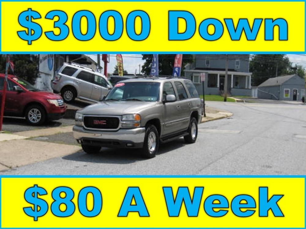 2002 Silver /Tan GMC Yukon 4WD (1GKEK13Z72R) with an 5.3L V8 OHV 16V FFV engine, 4-Speed Automatic Overdrive transmission, located at 577 Chester Pike, Prospect Park, PA, 19076, (610) 237-1015, 39.886154, -75.302338 - Photo #0