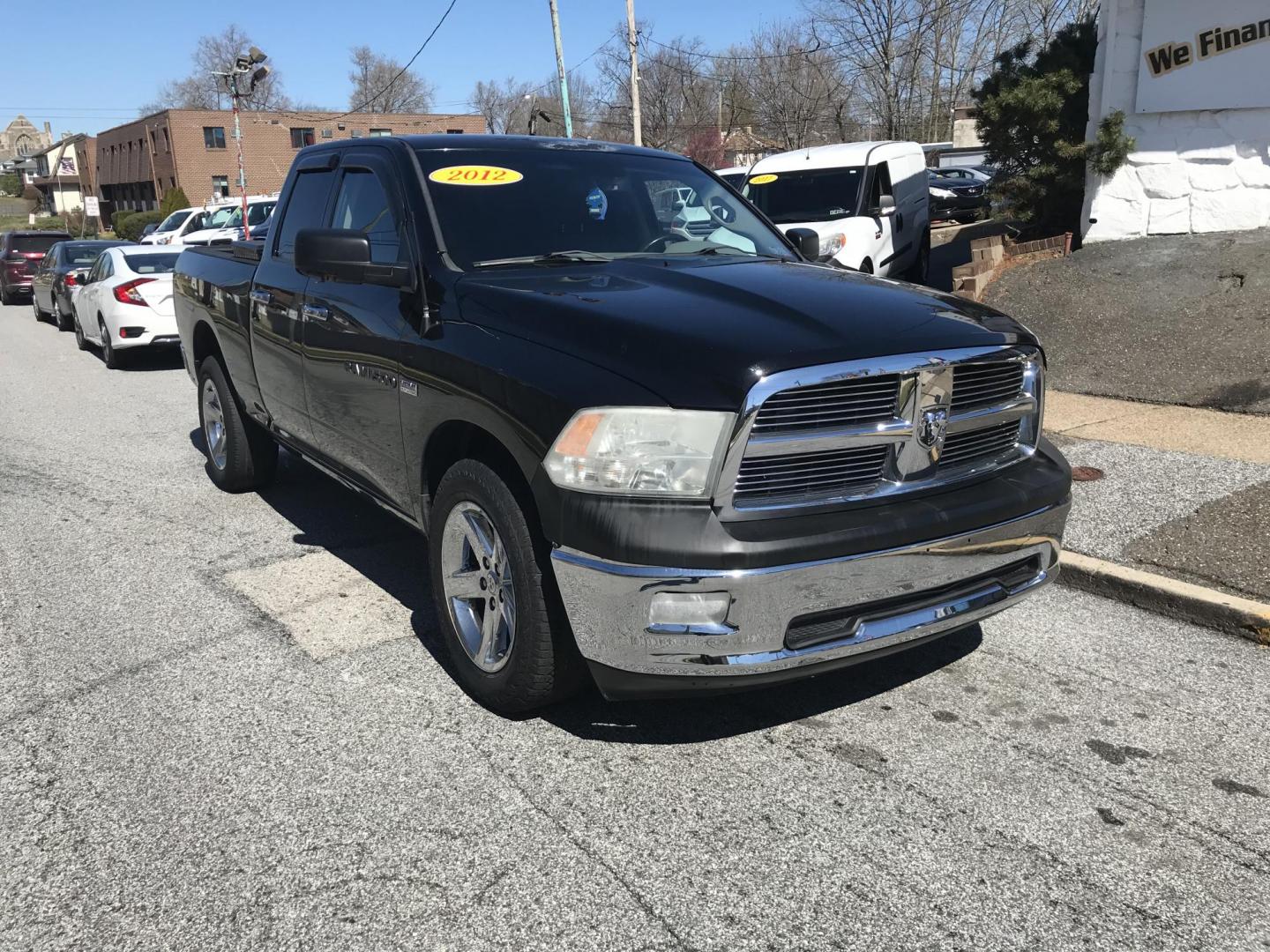 2012 Black /Tan Dodge Ram 1500 SLT Quad Cab 4WD (1C6RD7GT9CS) with an 5.7L V8 OHV 16V engine, 5-Speed Automatic transmission, located at 577 Chester Pike, Prospect Park, PA, 19076, (610) 237-1015, 39.886154, -75.302338 - Photo#2