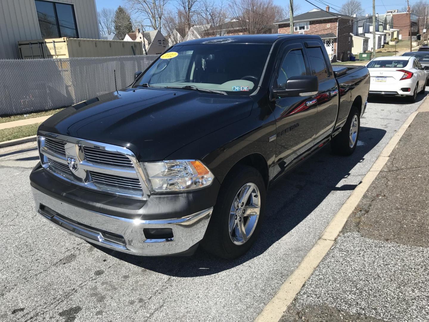 2012 Black /Tan Dodge Ram 1500 SLT Quad Cab 4WD (1C6RD7GT9CS) with an 5.7L V8 OHV 16V engine, 5-Speed Automatic transmission, located at 577 Chester Pike, Prospect Park, PA, 19076, (610) 237-1015, 39.886154, -75.302338 - Photo#3