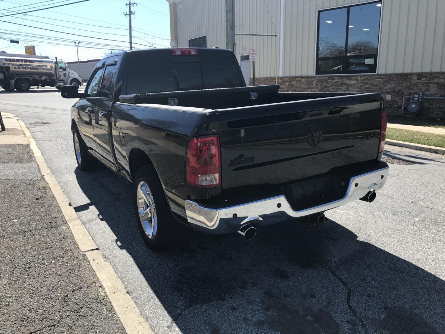 2012 Black /Tan Dodge Ram 1500 SLT Quad Cab 4WD (1C6RD7GT9CS) with an 5.7L V8 OHV 16V engine, 5-Speed Automatic transmission, located at 577 Chester Pike, Prospect Park, PA, 19076, (610) 237-1015, 39.886154, -75.302338 - Photo#5