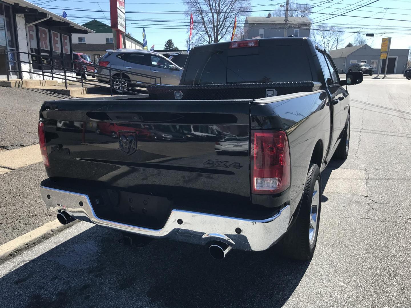 2012 Black /Tan Dodge Ram 1500 SLT Quad Cab 4WD (1C6RD7GT9CS) with an 5.7L V8 OHV 16V engine, 5-Speed Automatic transmission, located at 577 Chester Pike, Prospect Park, PA, 19076, (610) 237-1015, 39.886154, -75.302338 - Photo#8