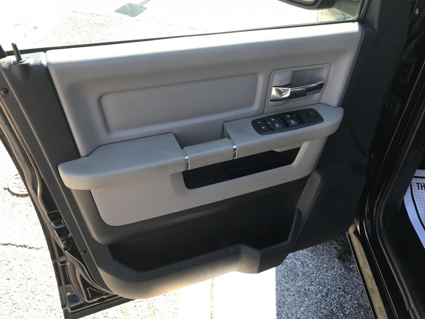 2012 Black /Tan Dodge Ram 1500 SLT Quad Cab 4WD (1C6RD7GT9CS) with an 5.7L V8 OHV 16V engine, 5-Speed Automatic transmission, located at 577 Chester Pike, Prospect Park, PA, 19076, (610) 237-1015, 39.886154, -75.302338 - Photo#9