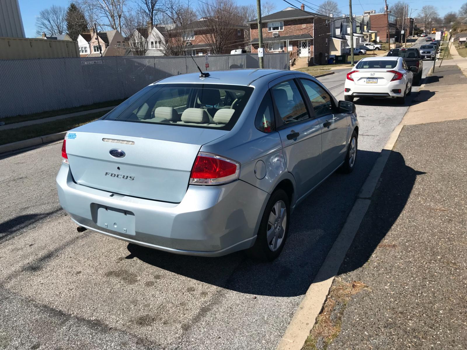 2009 Blue /Gray Ford Focus S Sedan (1FAHP34N29W) with an 2.0L L4 DOHC 16V engine, Automatic transmission, located at 577 Chester Pike, Prospect Park, PA, 19076, (610) 237-1015, 39.886154, -75.302338 - Photo #4