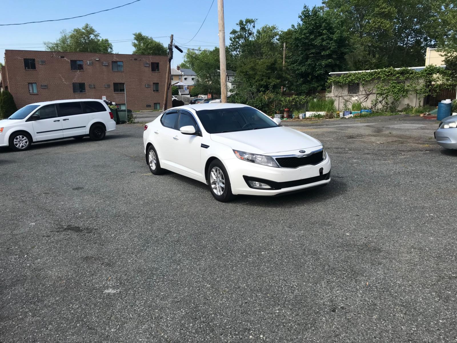 2013 White /Gray Kia Optima LX (KNAGM4A77D5) with an 2.4L L4 DOHC 16V engine, Automatic transmission, located at 577 Chester Pike, Prospect Park, PA, 19076, (610) 237-1015, 39.886154, -75.302338 - Photo #1