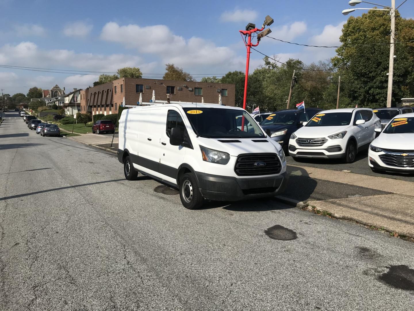 2015 White /Gray Ford Transit 150 Van Low Roof 60/40 Pass. 148-in. WB (1FTNE9ZM7FK) with an 3.7L V6 DOHC 24V engine, 6-Speed Automatic transmission, located at 577 Chester Pike, Prospect Park, PA, 19076, (610) 237-1015, 39.886154, -75.302338 - 15 Ford Transit 150: Ladder racks, multiple pieces of shelving, partition, brand new inspection, runs LIKE NEW! This vehicle comes inspected and has been given a bumper to bumper safety check. It is very clean, reliable, and well maintained. We offer a unique pay plan that is known for being the- Photo#1