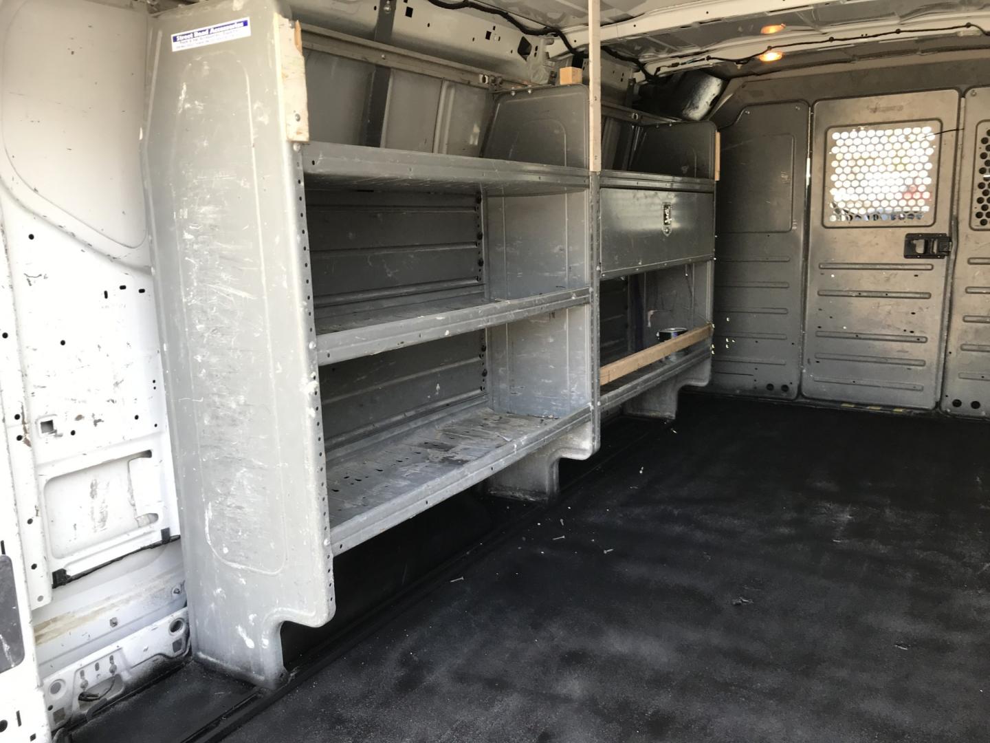 2015 White /Gray Ford Transit 150 Van Low Roof 60/40 Pass. 148-in. WB (1FTNE9ZM7FK) with an 3.7L V6 DOHC 24V engine, 6-Speed Automatic transmission, located at 577 Chester Pike, Prospect Park, PA, 19076, (610) 237-1015, 39.886154, -75.302338 - 15 Ford Transit 150: Ladder racks, multiple pieces of shelving, partition, brand new inspection, runs LIKE NEW! This vehicle comes inspected and has been given a bumper to bumper safety check. It is very clean, reliable, and well maintained. We offer a unique pay plan that is known for being the- Photo#15