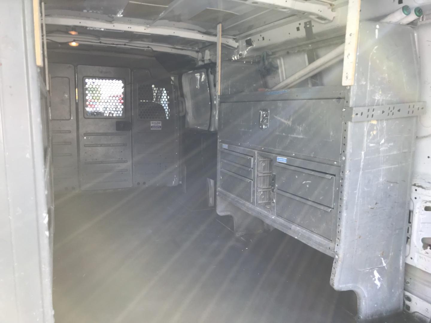 2015 White /Gray Ford Transit 150 Van Low Roof 60/40 Pass. 148-in. WB (1FTNE9ZM7FK) with an 3.7L V6 DOHC 24V engine, 6-Speed Automatic transmission, located at 577 Chester Pike, Prospect Park, PA, 19076, (610) 237-1015, 39.886154, -75.302338 - 15 Ford Transit 150: Ladder racks, multiple pieces of shelving, partition, brand new inspection, runs LIKE NEW! This vehicle comes inspected and has been given a bumper to bumper safety check. It is very clean, reliable, and well maintained. We offer a unique pay plan that is known for being the- Photo#16