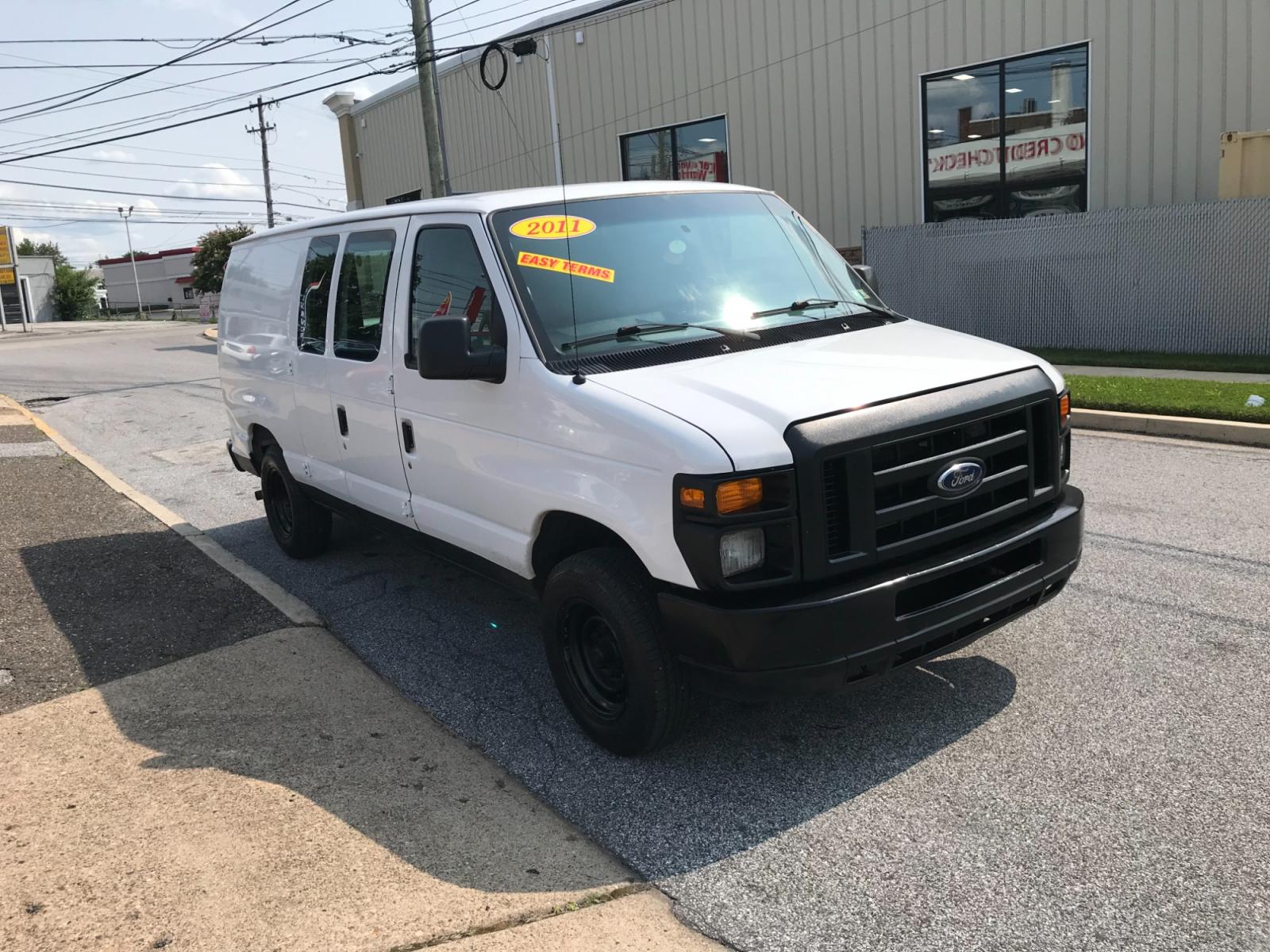 2011 White /Gray Ford E-Series Van E-150 (1FTNE1EW4BD) with an 4.6L V8 SOHC 16V engine, 4-Speed Automatic transmission, located at 577 Chester Pike, Prospect Park, PA, 19076, (610) 237-1015, 39.886154, -75.302338 - Photo #2