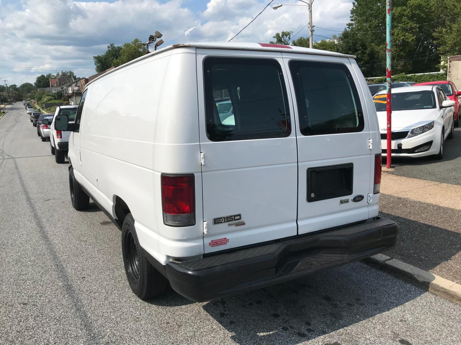 2011 White /Gray Ford E-Series Van E-150 (1FTNE1EW4BD) with an 4.6L V8 SOHC 16V engine, 4-Speed Automatic transmission, located at 577 Chester Pike, Prospect Park, PA, 19076, (610) 237-1015, 39.886154, -75.302338 - Photo #4