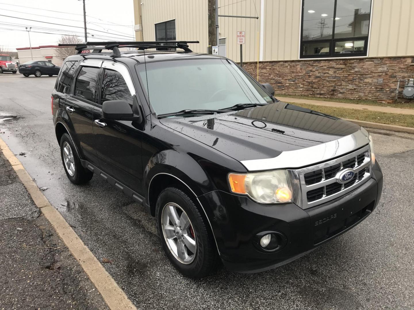 2010 Black /Gray Ford Escape XLT 4WD (1FMCU9DG4AK) with an 3.0L V6 DOHC 24V engine, 6-Speed Automatic transmission, located at 577 Chester Pike, Prospect Park, PA, 19076, (610) 237-1015, 39.886154, -75.302338 - Photo#1