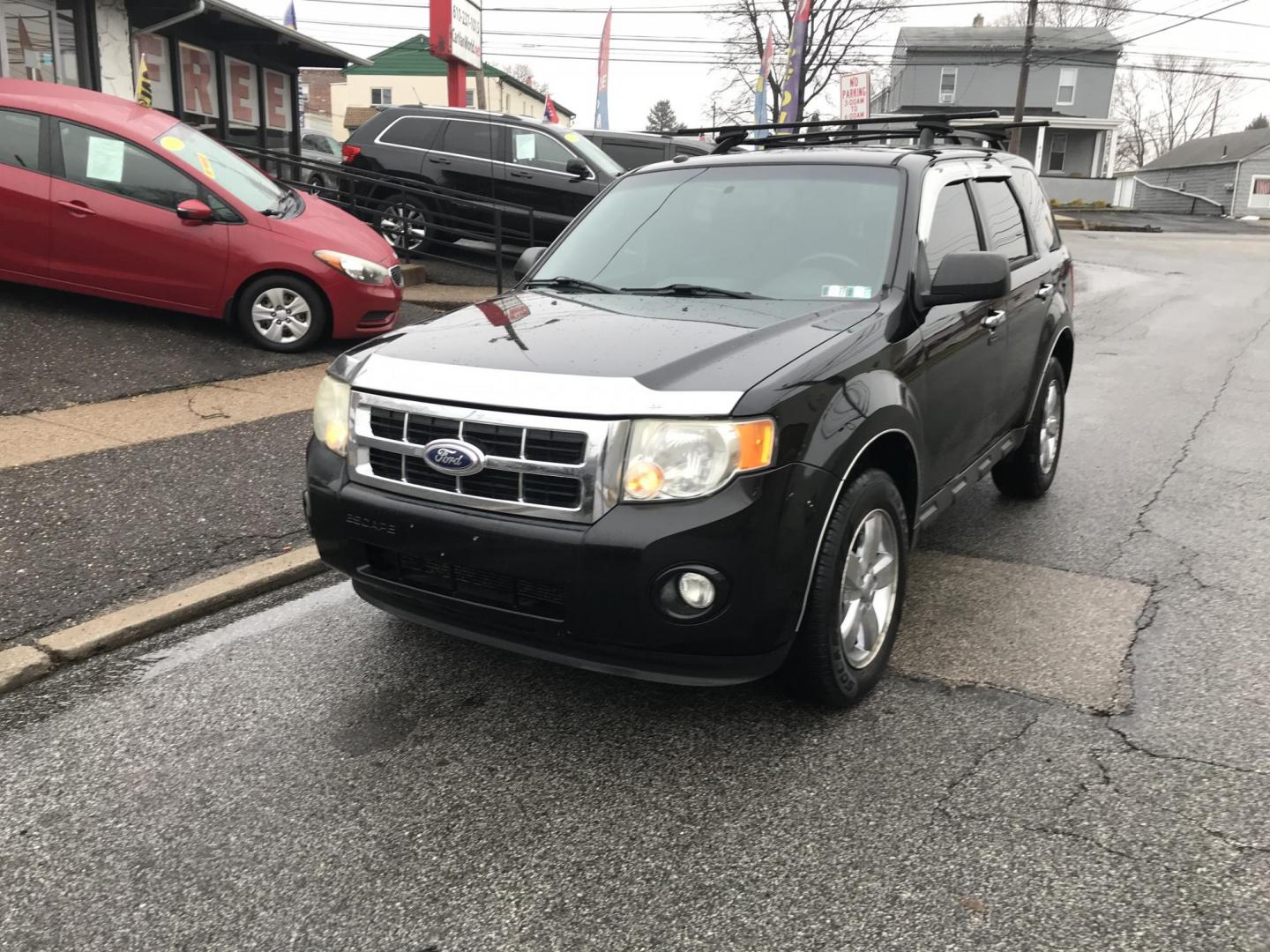 2010 Black /Gray Ford Escape XLT 4WD (1FMCU9DG4AK) with an 3.0L V6 DOHC 24V engine, 6-Speed Automatic transmission, located at 577 Chester Pike, Prospect Park, PA, 19076, (610) 237-1015, 39.886154, -75.302338 - Photo#0