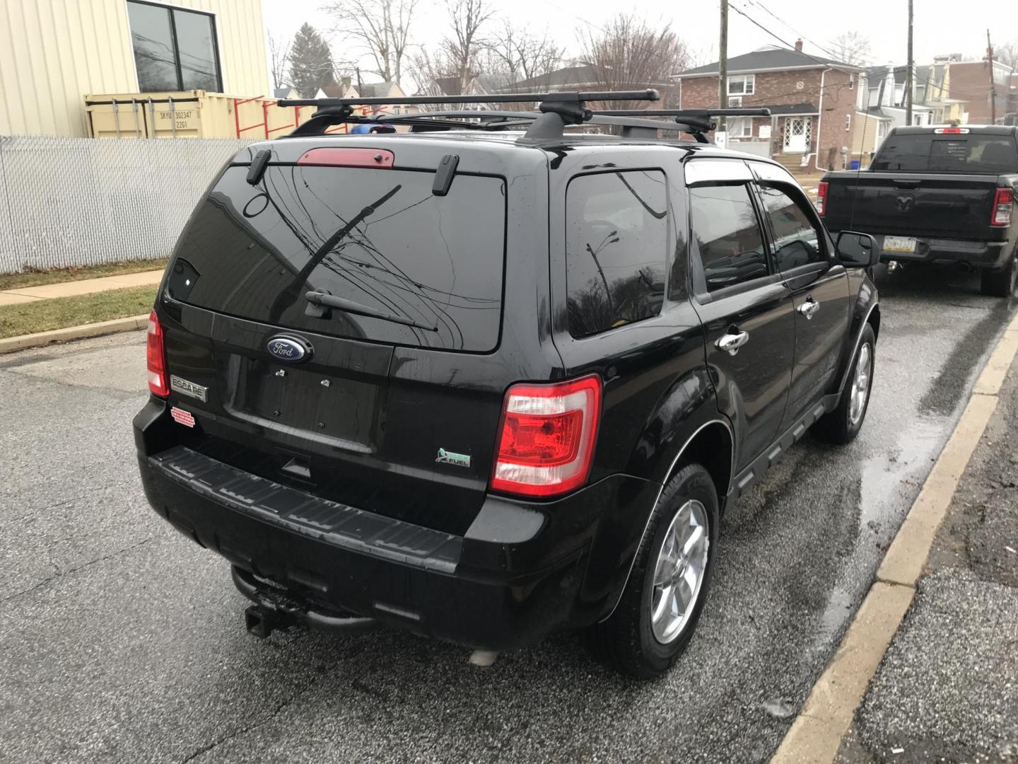 2010 Black /Gray Ford Escape XLT 4WD (1FMCU9DG4AK) with an 3.0L V6 DOHC 24V engine, 6-Speed Automatic transmission, located at 577 Chester Pike, Prospect Park, PA, 19076, (610) 237-1015, 39.886154, -75.302338 - Photo#2