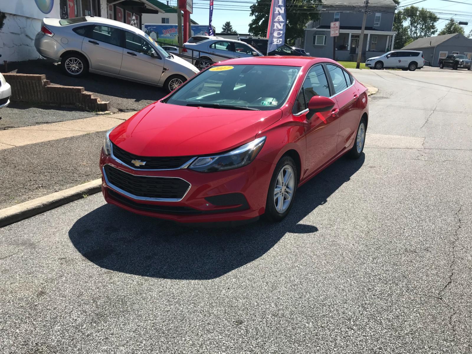 2017 Red /Gray Chevrolet Cruze LT Auto (1G1BE5SM0H7) with an 1.4L L4 DOHC 16V TURBO engine, 6A transmission, located at 577 Chester Pike, Prospect Park, PA, 19076, (610) 237-1015, 39.886154, -75.302338 - Photo #2