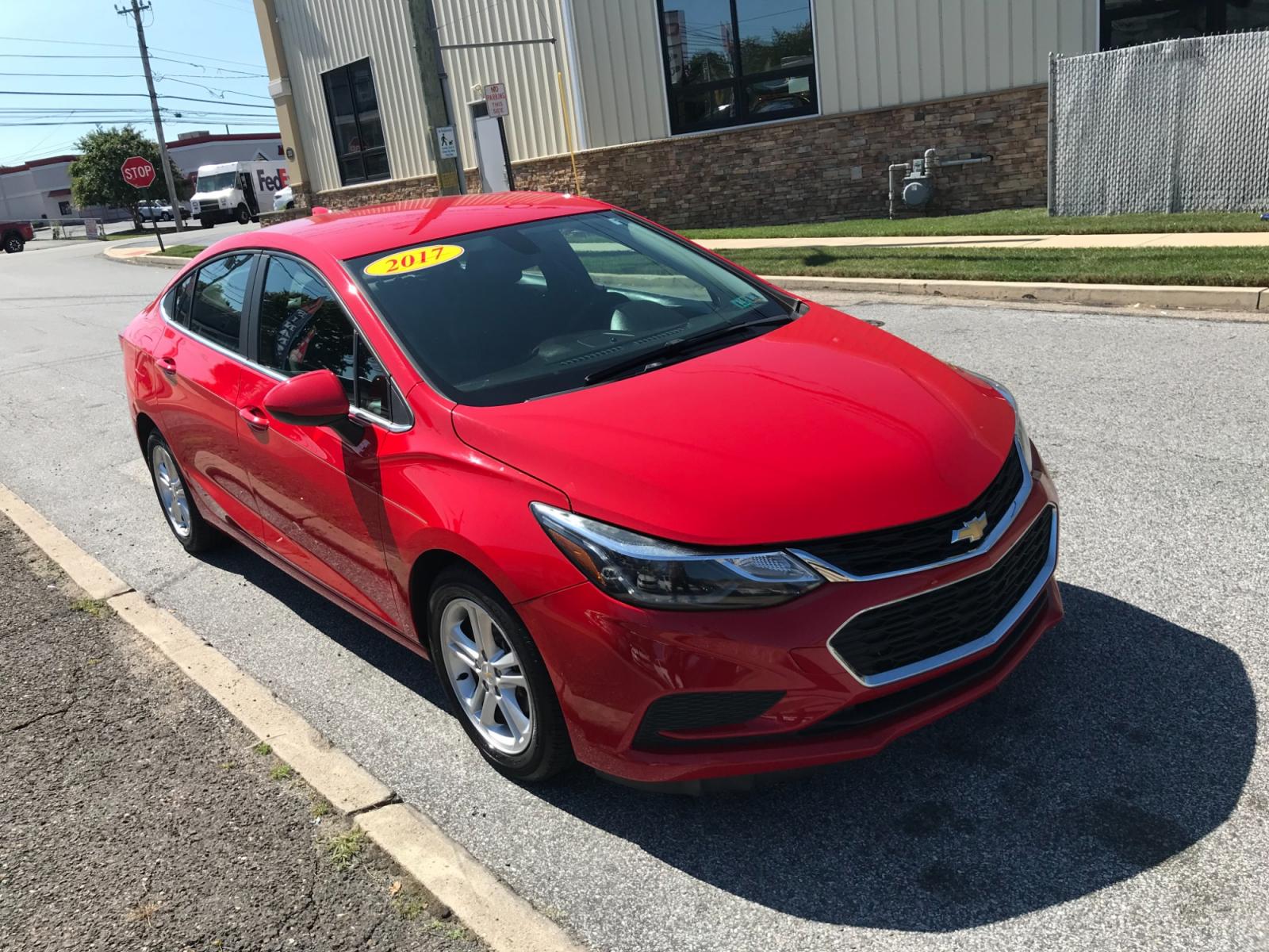 2017 Red /Gray Chevrolet Cruze LT Auto (1G1BE5SM0H7) with an 1.4L L4 DOHC 16V TURBO engine, 6A transmission, located at 577 Chester Pike, Prospect Park, PA, 19076, (610) 237-1015, 39.886154, -75.302338 - Photo #3