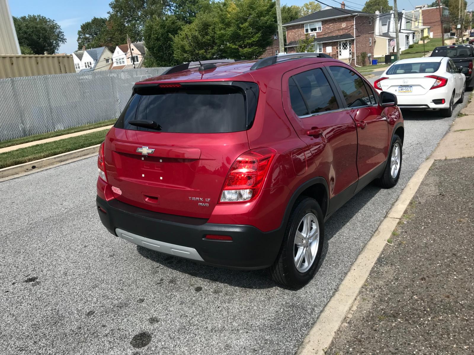2015 Red /Gray Chevrolet Trax LT AWD (KL7CJRSB0FB) with an 1.4L L4 DOHC 16V FFV engine, Automatic transmission, located at 577 Chester Pike, Prospect Park, PA, 19076, (610) 237-1015, 39.886154, -75.302338 - 15 Chevy Trax LT: Only 110k miles, AWD, sunroof, backup camera, SUPER CLEAN! This vehicle comes inspected and has been given a bumper to bumper safety check. It is very clean, reliable, and well maintained. We offer a unique pay plan that is known for being the easiest and fastest financing optio - Photo #3