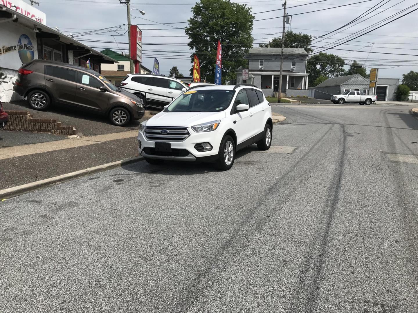 2018 White /Gray Ford Escape SE 4WD (1FMCU9GD7JU) with an 1.5L L4 DOHC 16V engine, 6A transmission, located at 577 Chester Pike, Prospect Park, PA, 19076, (610) 237-1015, 39.886154, -75.302338 - 18 Ford Escape SE: Navigation system, backup camera, looks and runs LIKE NEW! This vehicle comes inspected and has been given a bumper to bumper safety check. It is very clean, reliable, and well maintained. We offer a unique pay plan that is known for being the easiest and fastest financing opti - Photo#1