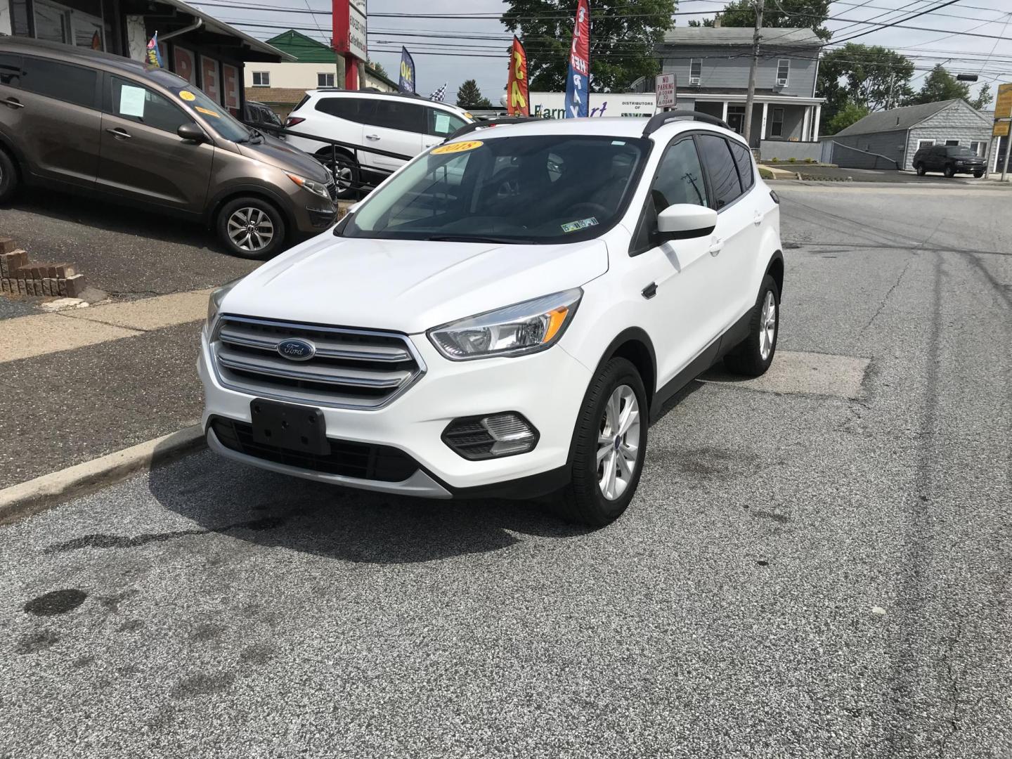 2018 White /Gray Ford Escape SE 4WD (1FMCU9GD7JU) with an 1.5L L4 DOHC 16V engine, 6A transmission, located at 577 Chester Pike, Prospect Park, PA, 19076, (610) 237-1015, 39.886154, -75.302338 - 18 Ford Escape SE: Navigation system, backup camera, looks and runs LIKE NEW! This vehicle comes inspected and has been given a bumper to bumper safety check. It is very clean, reliable, and well maintained. We offer a unique pay plan that is known for being the easiest and fastest financing opti - Photo#2
