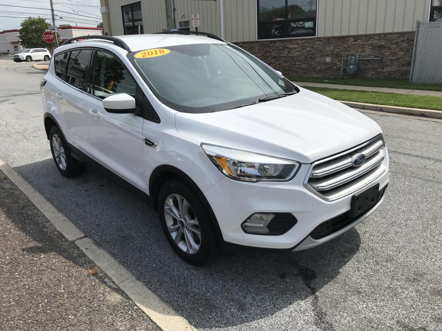 2018 White /Gray Ford Escape SE 4WD (1FMCU9GD7JU) with an 1.5L L4 DOHC 16V engine, 6A transmission, located at 577 Chester Pike, Prospect Park, PA, 19076, (610) 237-1015, 39.886154, -75.302338 - 18 Ford Escape SE: Navigation system, backup camera, looks and runs LIKE NEW! This vehicle comes inspected and has been given a bumper to bumper safety check. It is very clean, reliable, and well maintained. We offer a unique pay plan that is known for being the easiest and fastest financing opti - Photo#3