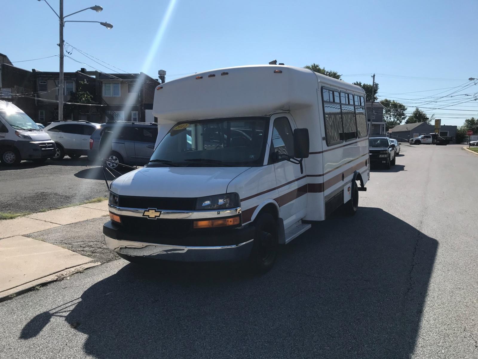 2012 White /Gray Chevrolet Express 3500 BUS (1GB3G3BLXC1) with an 6.6L engine, Automatic transmission, located at 577 Chester Pike, Prospect Park, PA, 19076, (610) 237-1015, 39.886154, -75.302338 - Photo #2