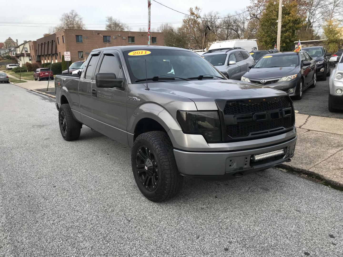 2011 Gray /Gray Ford F-150 FX4 SuperCab 6.5-ft. Bed 4WD (1FTEX1EM8BF) with an 3.7L V6 DOHC 24V engine, 4-Speed Automatic transmission, located at 577 Chester Pike, Prospect Park, PA, 19076, (610) 237-1015, 39.886154, -75.302338 - Photo#0