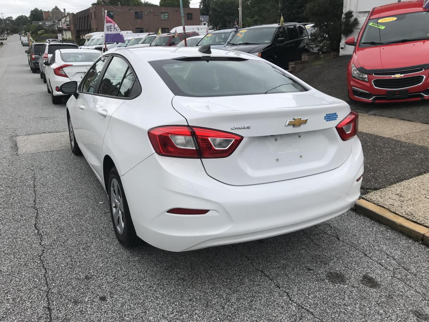 2018 White /Gray Chevrolet Cruze LS Auto (1G1BC5SM9J7) with an 1.4L L4 DOHC 16V TURBO engine, 6A transmission, located at 577 Chester Pike, Prospect Park, PA, 19076, (610) 237-1015, 39.886154, -75.302338 - 18 Chevy Cruze: Backup camera, great on gas, SUPER clean, runs LIKE NEW! This vehicle comes inspected and has been given a bumper to bumper safety check. It is very clean, reliable, and well maintained. We offer a unique pay plan that is known for being the easiest and fastest financing option in - Photo#5