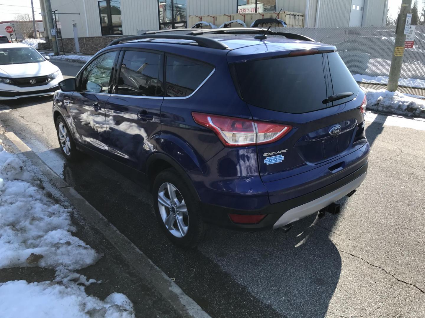 2014 Blue /Gray Ford Escape SE (1FMCU9G94EU) with an 2.0 V4 engine, Automatic transmission, located at 577 Chester Pike, Prospect Park, PA, 19076, (610) 237-1015, 39.886154, -75.302338 - Photo#5
