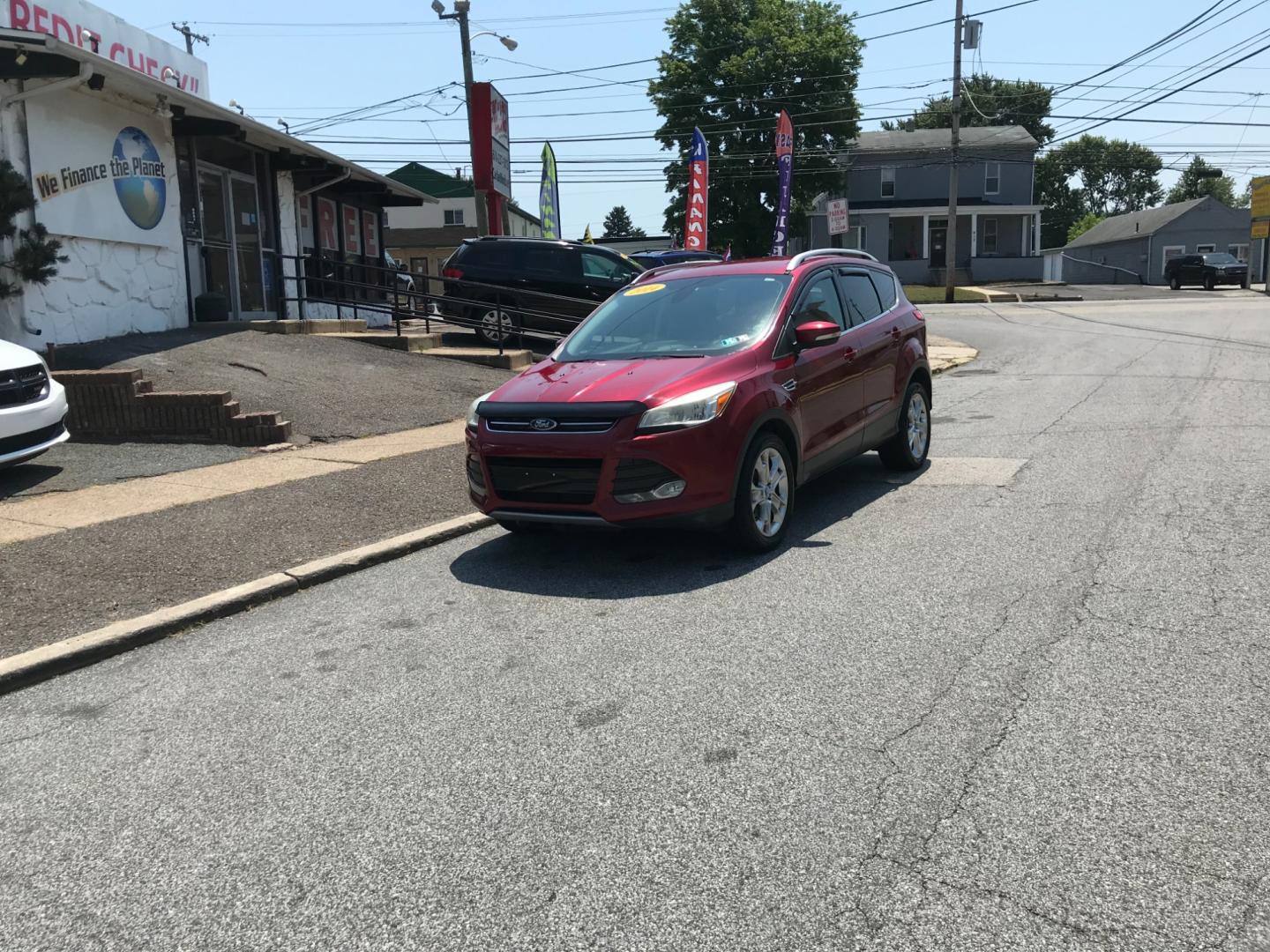 2014 Red /Gray Ford Escape Titanium (1FMCU9J99EU) with an 2.0 V4 engine, Automatic transmission, located at 577 Chester Pike, Prospect Park, PA, 19076, (610) 237-1015, 39.886154, -75.302338 - Photo#1