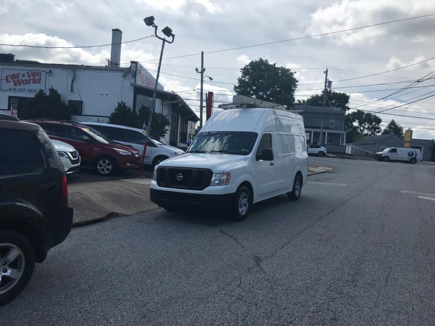 2018 White /Gray Nissan NV Cargo SV (1N6BF0LYXJN) with an 4.0 V6 engine, Automatic transmission, located at 577 Chester Pike, Prospect Park, PA, 19076, (610) 237-1015, 39.886154, -75.302338 - 2018 Nissan NV 2500 SV HD: High roof, ladder racks, multiple pieces of shelving, backup camera, new PA inspection, SUPER CLEAN, runs LIKE NEW! This vehicle comes inspected and has been given a bumper to bumper safety check. It is very clean, reliable, and well maintained. We offer a unique pay pl - Photo#1