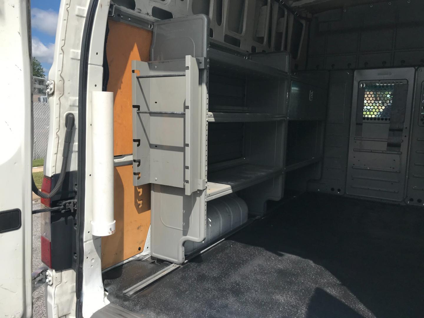 2018 White /Gray Nissan NV Cargo SV (1N6BF0LYXJN) with an 4.0 V6 engine, Automatic transmission, located at 577 Chester Pike, Prospect Park, PA, 19076, (610) 237-1015, 39.886154, -75.302338 - 2018 Nissan NV 2500 SV HD: High roof, ladder racks, multiple pieces of shelving, backup camera, new PA inspection, SUPER CLEAN, runs LIKE NEW! This vehicle comes inspected and has been given a bumper to bumper safety check. It is very clean, reliable, and well maintained. We offer a unique pay pl - Photo#18