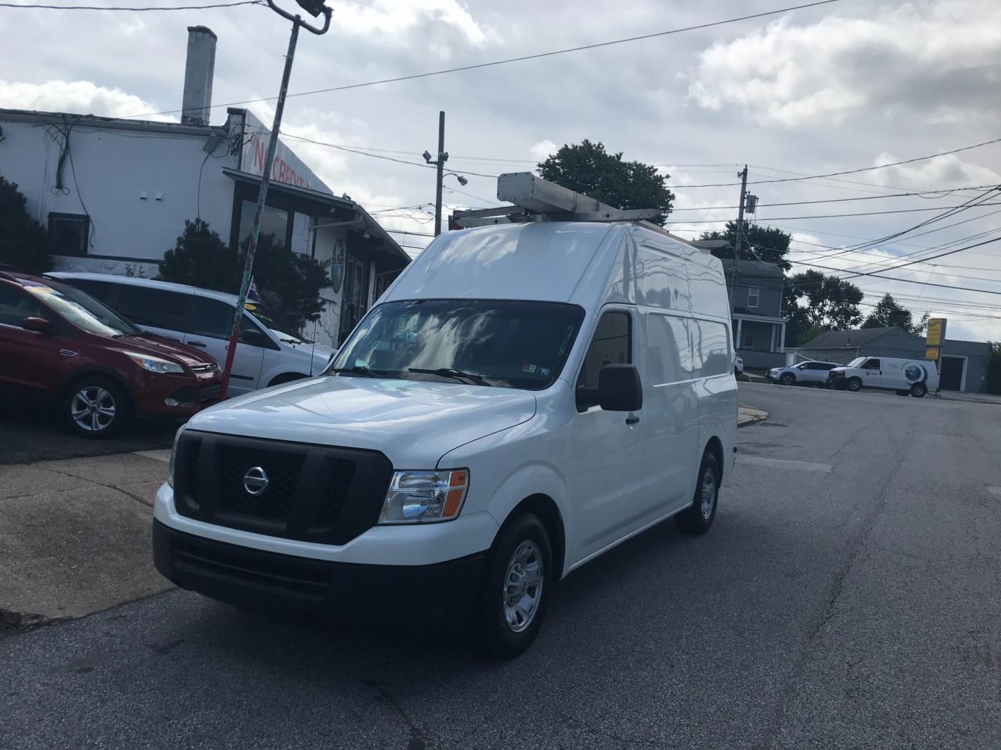 2018 White /Gray Nissan NV Cargo SV (1N6BF0LYXJN) with an 4.0 V6 engine, Automatic transmission, located at 577 Chester Pike, Prospect Park, PA, 19076, (610) 237-1015, 39.886154, -75.302338 - 2018 Nissan NV 2500 SV HD: High roof, ladder racks, multiple pieces of shelving, backup camera, new PA inspection, SUPER CLEAN, runs LIKE NEW! This vehicle comes inspected and has been given a bumper to bumper safety check. It is very clean, reliable, and well maintained. We offer a unique pay pl - Photo#2
