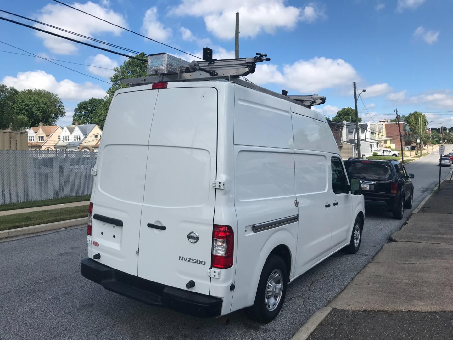 2018 White /Gray Nissan NV Cargo SV (1N6BF0LYXJN) with an 4.0 V6 engine, Automatic transmission, located at 577 Chester Pike, Prospect Park, PA, 19076, (610) 237-1015, 39.886154, -75.302338 - 2018 Nissan NV 2500 SV HD: High roof, ladder racks, multiple pieces of shelving, backup camera, new PA inspection, SUPER CLEAN, runs LIKE NEW! This vehicle comes inspected and has been given a bumper to bumper safety check. It is very clean, reliable, and well maintained. We offer a unique pay pl - Photo#4