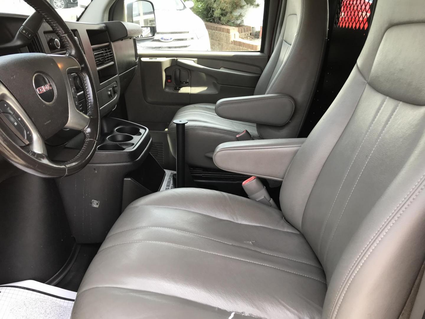 2014 Maroon /Gray GMC Savana 3500 (1GTZ7TCA0E1) with an 4.8 V8 engine, Automatic transmission, located at 577 Chester Pike, Prospect Park, PA, 19076, (610) 237-1015, 39.886154, -75.302338 - 2014 GMC Savana 3500 Cargo Van: partition with door, new PA inspection, power locks and windows, runs LIKE NEW! This vehicle comes inspected and has been given a bumper to bumper safety check. It is very clean, reliable, and well maintained. We offer a unique pay plan that is known for being the - Photo#9