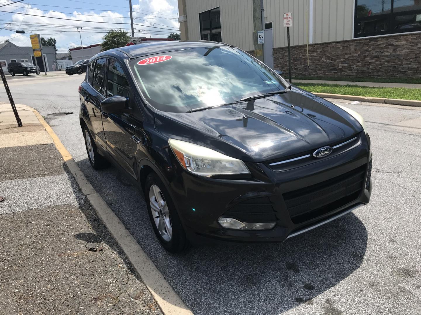 2014 Black /Black Ford Escape SE (1FMCU9GX3EU) with an 1.6 V4 engine, Automatic transmission, located at 577 Chester Pike, Prospect Park, PA, 19076, (610) 237-1015, 39.886154, -75.302338 - 2014 Ford Escape SE: 4x4, backup camera, new PA inspection, SUPER CLEAN, runs LIKE NEW! This vehicle comes inspected and has been given a bumper to bumper safety check. It is very clean, reliable, and well maintained. We offer a unique pay plan that is known for being the easiest and fastest fina- Photo#3