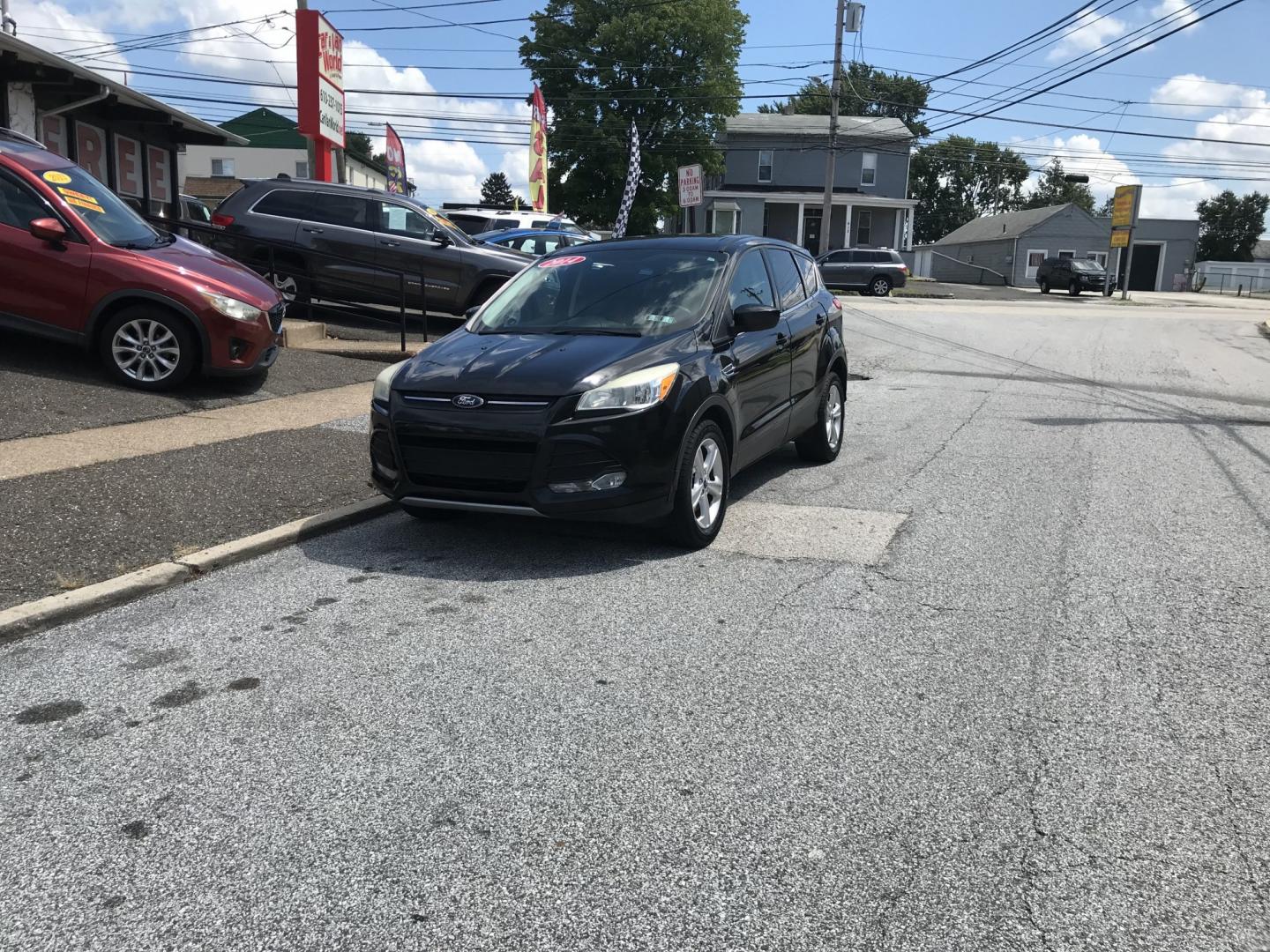 2014 Black /Black Ford Escape SE (1FMCU9GX3EU) with an 1.6 V4 engine, Automatic transmission, located at 577 Chester Pike, Prospect Park, PA, 19076, (610) 237-1015, 39.886154, -75.302338 - 2014 Ford Escape SE: 4x4, backup camera, new PA inspection, SUPER CLEAN, runs LIKE NEW! This vehicle comes inspected and has been given a bumper to bumper safety check. It is very clean, reliable, and well maintained. We offer a unique pay plan that is known for being the easiest and fastest fina- Photo#1
