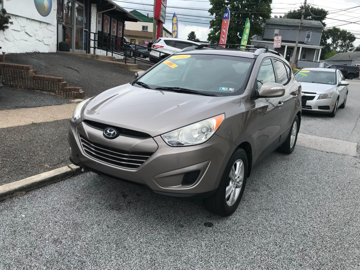 2012 Brown /Gray Hyundai Tucson GLS (KM8JUCAC7CU) with an 2.4 V4 engine, Automatic transmission, located at 577 Chester Pike, Prospect Park, PA, 19076, (610) 237-1015, 39.886154, -75.302338 - Photo#1