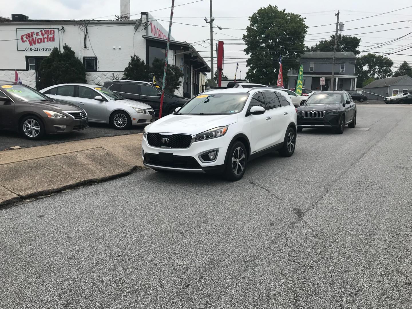 2016 White /Black Kia Sorento EX (5XYPHDA58GG) with an 3.3 V6 engine, Automatic transmission, located at 577 Chester Pike, Prospect Park, PA, 19076, (610) 237-1015, 39.886154, -75.302338 - 2016 Kia Sorento EX: Only 119k miles, 3rd row seating, AWD, backup camera, tow hitch, SUPER CLEAN, runs LIKE NEW! This vehicle comes inspected and has been given a bumper to bumper safety check. It is very clean, reliable, and well maintained. We offer a unique pay plan that is known for being th - Photo#1