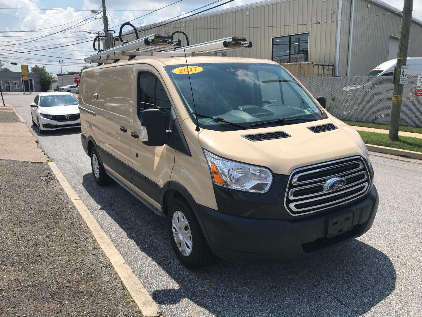 2017 Tan /Gray Ford Transit 150 (1FTYE1YM2HK) with an 3.7 V6 engine, Automatic transmission, located at 577 Chester Pike, Prospect Park, PA, 19076, (610) 237-1015, 39.886154, -75.302338 - 2017 Ford Transit 150 Low Roof: Nice ladder racks that drop down, multiple pieces of shelving, bulkhead, no windows, PA inspection, FLEET MAINTAINED, runs LIKE NEW! This vehicle comes inspected and has been given a bumper to bumper safety check. It is very clean, reliable, and well maintained. We - Photo#3