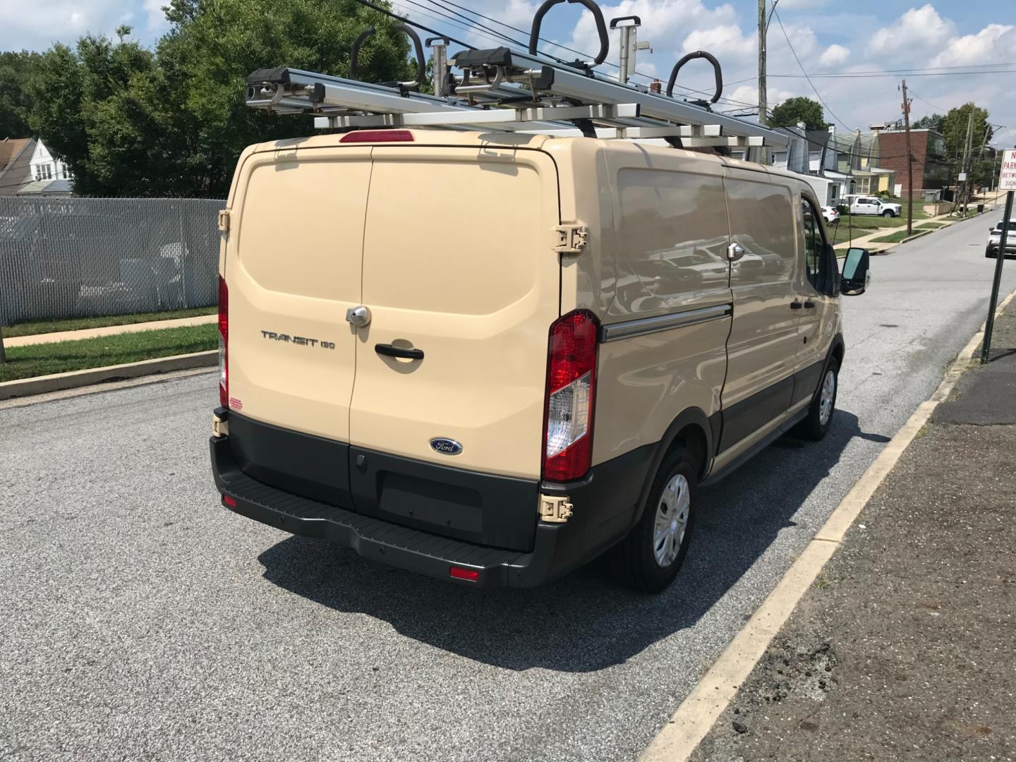 2017 Tan /Gray Ford Transit 150 (1FTYE1YM2HK) with an 3.7 V6 engine, Automatic transmission, located at 577 Chester Pike, Prospect Park, PA, 19076, (610) 237-1015, 39.886154, -75.302338 - 2017 Ford Transit 150 Low Roof: Nice ladder racks that drop down, multiple pieces of shelving, bulkhead, no windows, PA inspection, FLEET MAINTAINED, runs LIKE NEW! This vehicle comes inspected and has been given a bumper to bumper safety check. It is very clean, reliable, and well maintained. We - Photo#4