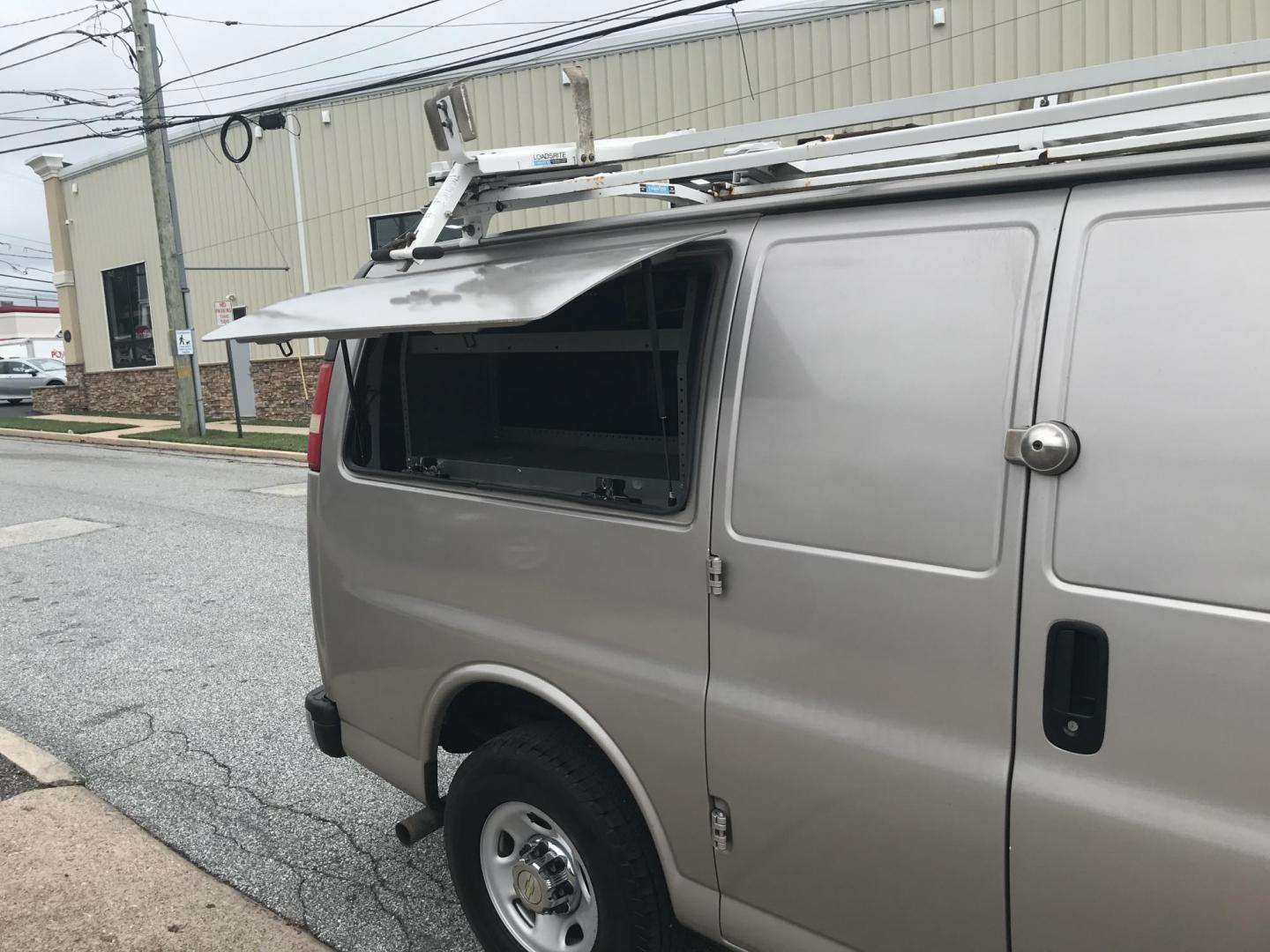 2014 Pewter /Gray Chevrolet Express 3500 Cargo (1GCZGTCG3E1) with an 6.0L V8 OHV 16V FFV engine, 6-Speed Automatic transmission, located at 577 Chester Pike, Prospect Park, PA, 19076, (610) 237-1015, 39.886154, -75.302338 - 2014 Chevrolet Express 3500 Cargo Van: Pop out side panels with remote, ladder racks, shelving, power inverter, trailer hitch, partition, new PA inspection, FLEET MAINTAINED, runs LIKE NEW! This vehicle comes inspected and has been given a bumper to bumper safety check. It is very clean, reliable - Photo#22