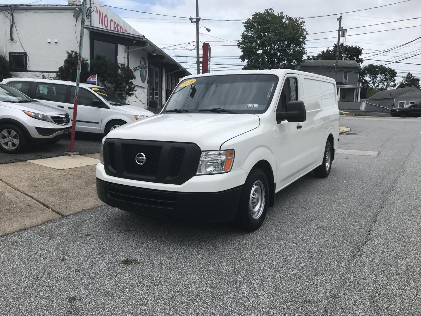 2018 White /Gray Nissan NV Cargo 1500 S (1N6BF0KM4JN) with an 4.0L V6 engine, 5A transmission, located at 577 Chester Pike, Prospect Park, PA, 19076, (610) 237-1015, 39.886154, -75.302338 - 2018 Nissan NV 1500 S: Shelving, backup camera, new PA inspection, heavy duty partition, FLEET MAINTAINED, runs LIKE NEW! This vehicle comes inspected and has been given a bumper to bumper safety check. It is very clean, reliable, and well maintained. We offer a unique pay plan that is known for - Photo#1
