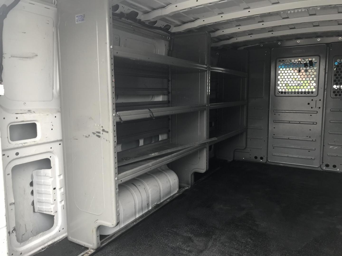 2018 White /Gray Nissan NV Cargo 1500 S (1N6BF0KM4JN) with an 4.0L V6 engine, 5A transmission, located at 577 Chester Pike, Prospect Park, PA, 19076, (610) 237-1015, 39.886154, -75.302338 - 2018 Nissan NV 1500 S: Shelving, backup camera, new PA inspection, heavy duty partition, FLEET MAINTAINED, runs LIKE NEW! This vehicle comes inspected and has been given a bumper to bumper safety check. It is very clean, reliable, and well maintained. We offer a unique pay plan that is known for - Photo#18