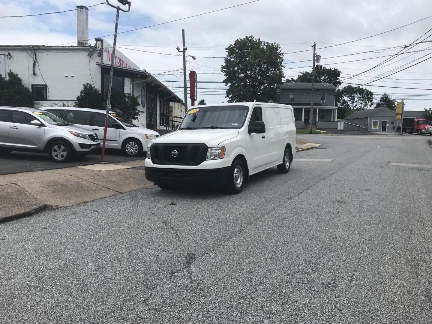 2018 White /Gray Nissan NV Cargo 1500 S (1N6BF0KM4JN) with an 4.0L V6 engine, 5A transmission, located at 577 Chester Pike, Prospect Park, PA, 19076, (610) 237-1015, 39.886154, -75.302338 - 2018 Nissan NV 1500 S: Shelving, backup camera, new PA inspection, heavy duty partition, FLEET MAINTAINED, runs LIKE NEW! This vehicle comes inspected and has been given a bumper to bumper safety check. It is very clean, reliable, and well maintained. We offer a unique pay plan that is known for - Photo#2