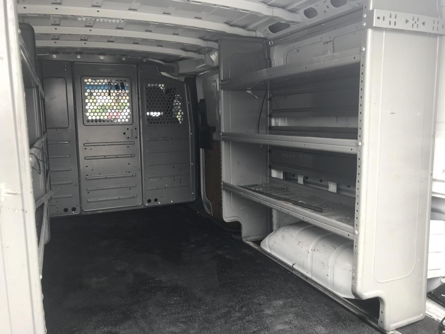 2018 White /Gray Nissan NV Cargo 1500 S (1N6BF0KM4JN) with an 4.0L V6 engine, 5A transmission, located at 577 Chester Pike, Prospect Park, PA, 19076, (610) 237-1015, 39.886154, -75.302338 - 2018 Nissan NV 1500 S: Shelving, backup camera, new PA inspection, heavy duty partition, FLEET MAINTAINED, runs LIKE NEW! This vehicle comes inspected and has been given a bumper to bumper safety check. It is very clean, reliable, and well maintained. We offer a unique pay plan that is known for - Photo#20
