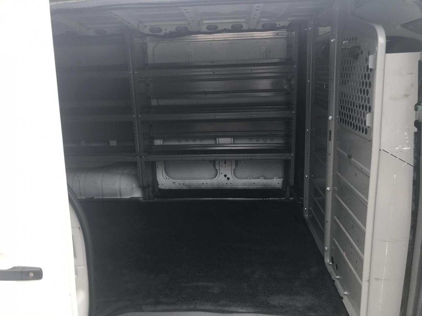 2018 White /Gray Nissan NV Cargo 1500 S (1N6BF0KM4JN) with an 4.0L V6 engine, 5A transmission, located at 577 Chester Pike, Prospect Park, PA, 19076, (610) 237-1015, 39.886154, -75.302338 - 2018 Nissan NV 1500 S: Shelving, backup camera, new PA inspection, heavy duty partition, FLEET MAINTAINED, runs LIKE NEW! This vehicle comes inspected and has been given a bumper to bumper safety check. It is very clean, reliable, and well maintained. We offer a unique pay plan that is known for - Photo#21